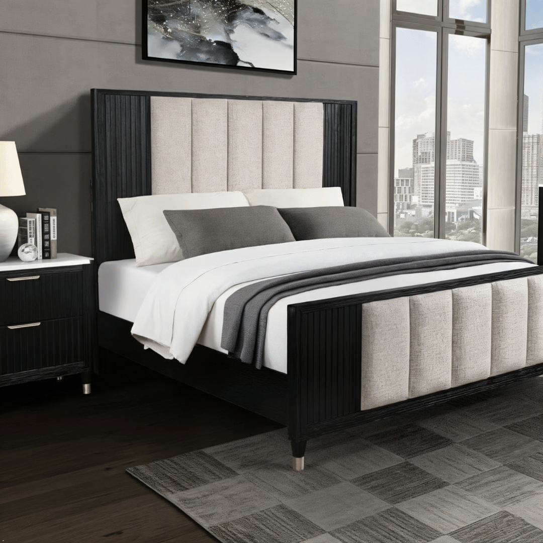 Modern bedroom with a black and gray upholstered bed, nightstands, and large windows.
