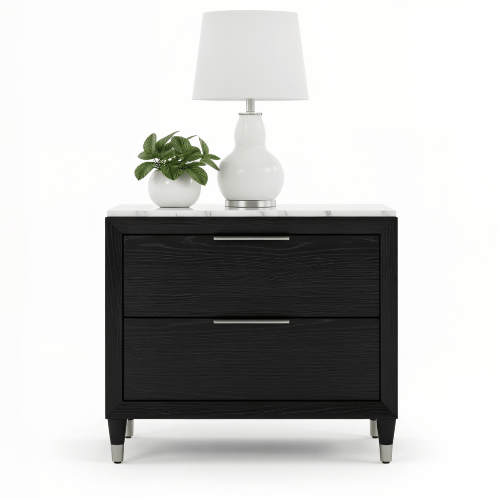 Black nightstand with two drawers, a white lamp, and a small plant on a white background
