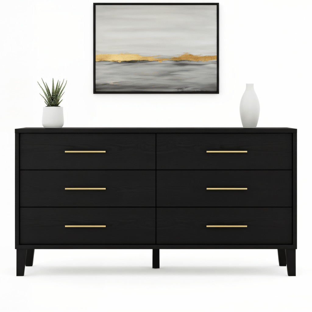 Black dresser with gold handles in a room setting with a painting and plants.