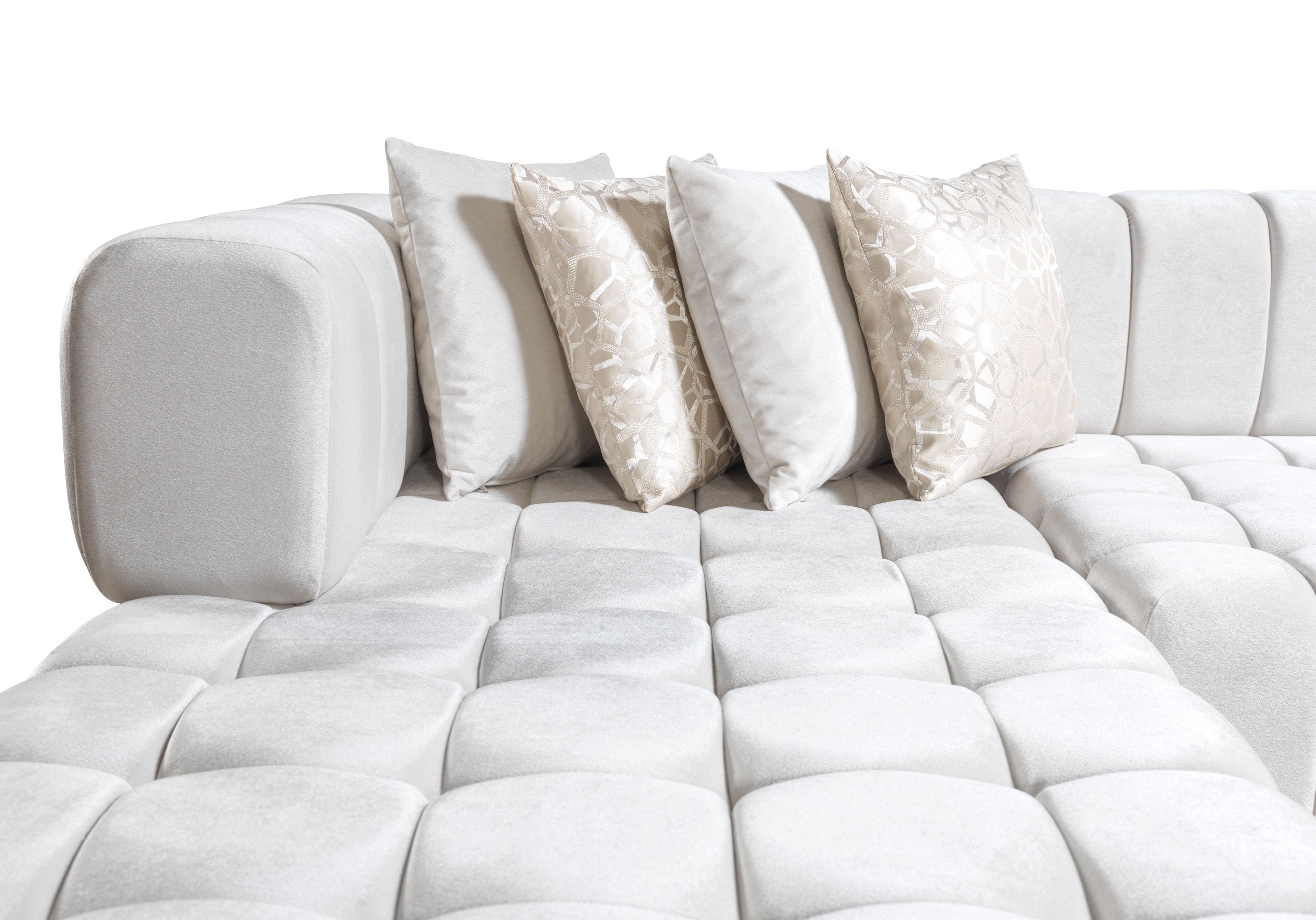 White sectional sofa with decorative pillows on a white background