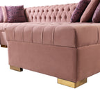 Pink velvet sectional sofa with tufted backrest and gold feet on a white background