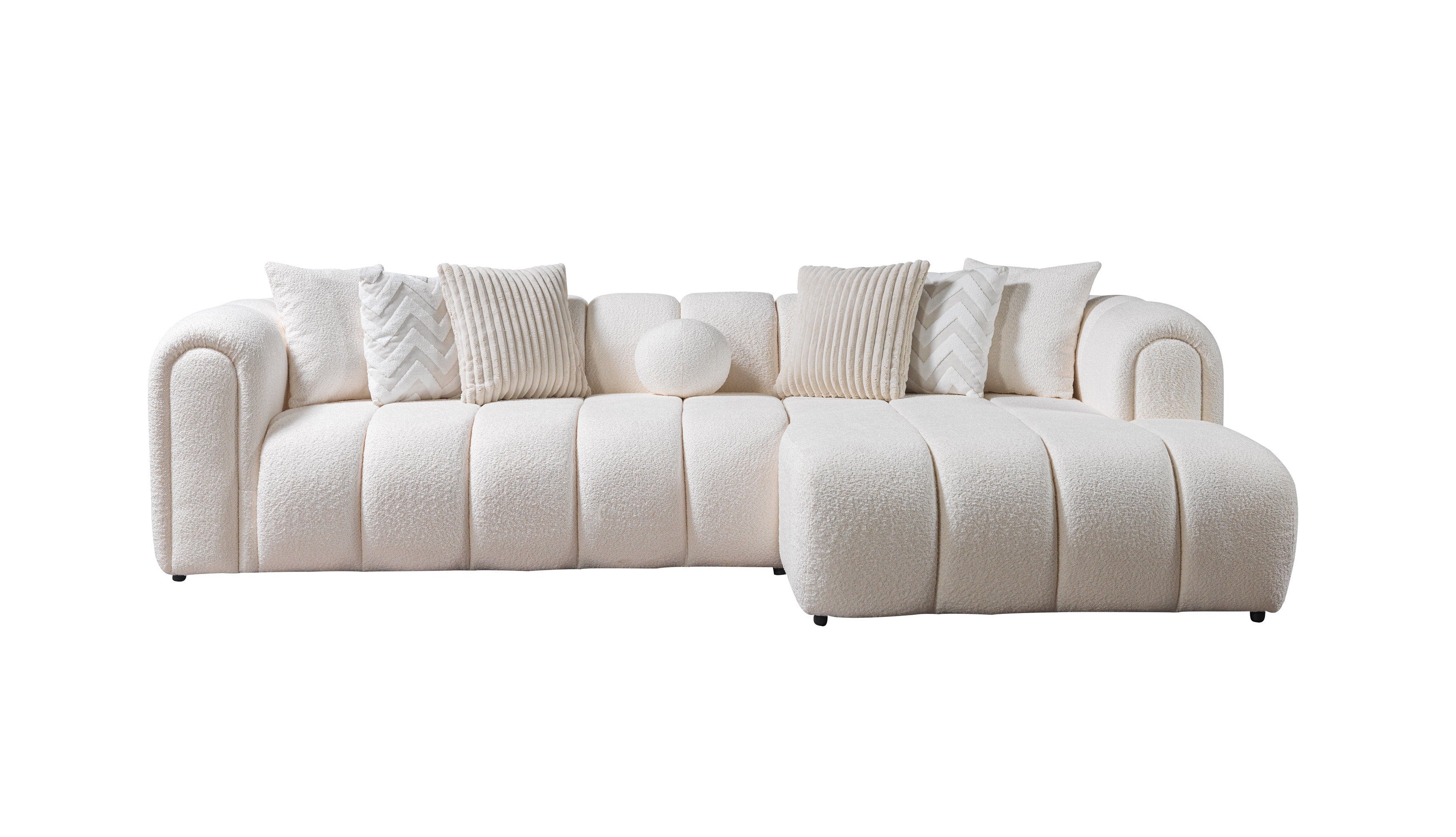 White sectional sofa with cushions on a white background