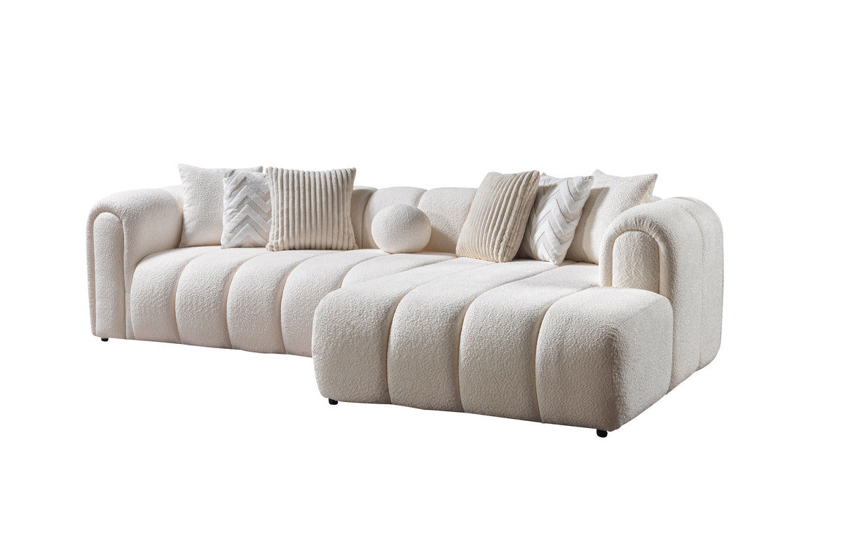 Beige sofa with decorative pillows on a white background