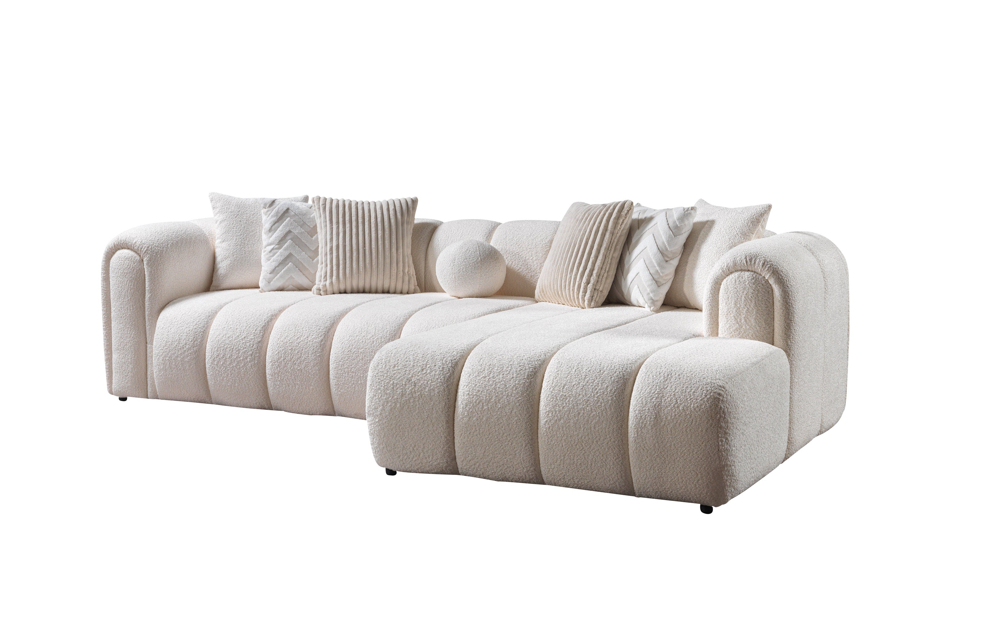 Beige sofa with decorative pillows on a white background