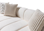 White textured sofa with decorative pillows on a white background