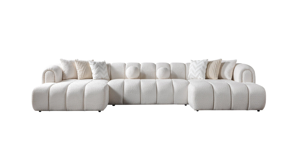 White sectional sofa with cushions on a white background