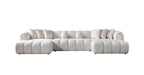 White sectional sofa with cushions on a white background