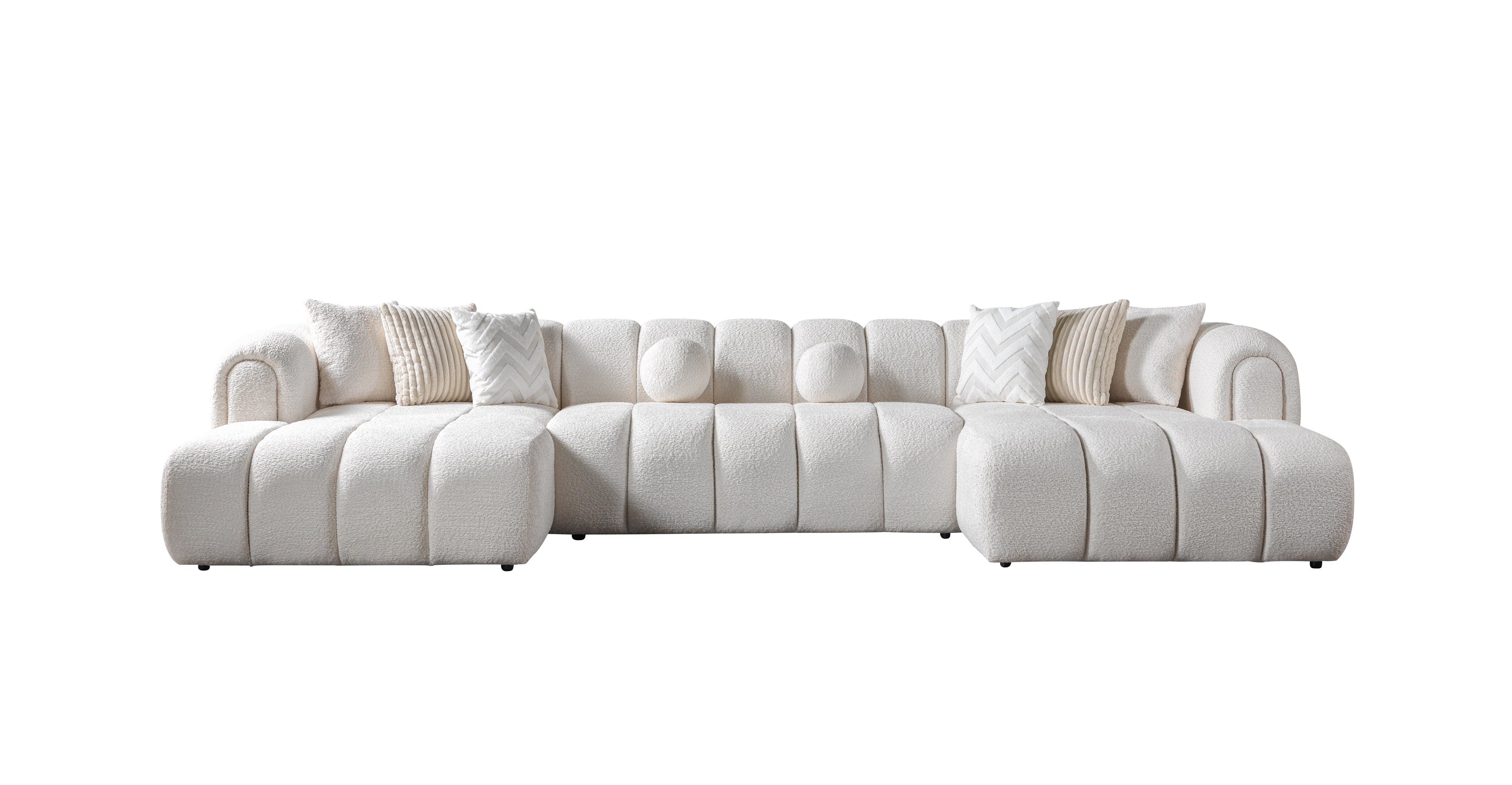 White sectional sofa with cushions on a white background