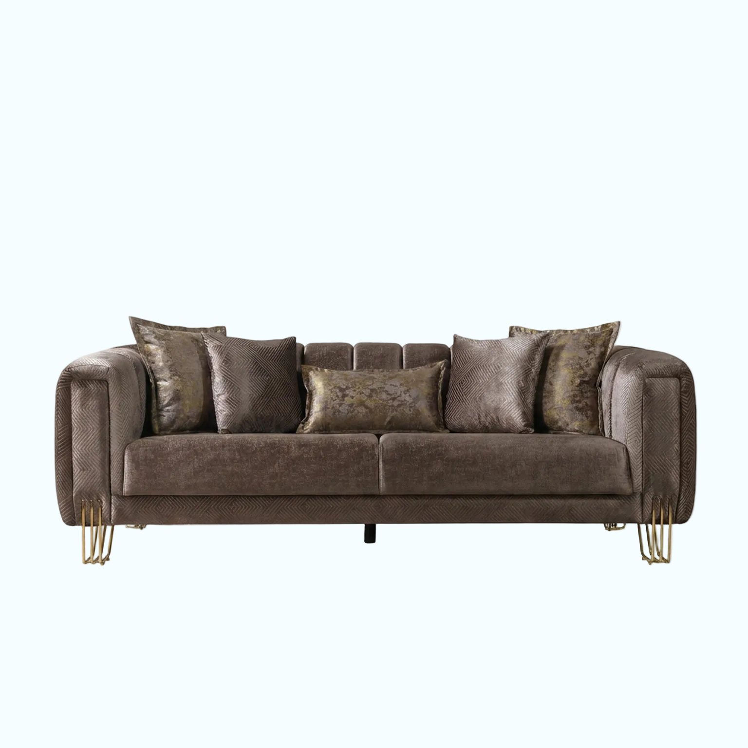 A modern three-seater sofa upholstered in textured brown fabric with matching throw pillows and two decorative patterned pillows, supported by slim gold metal legs, shown against a solid light blue background.