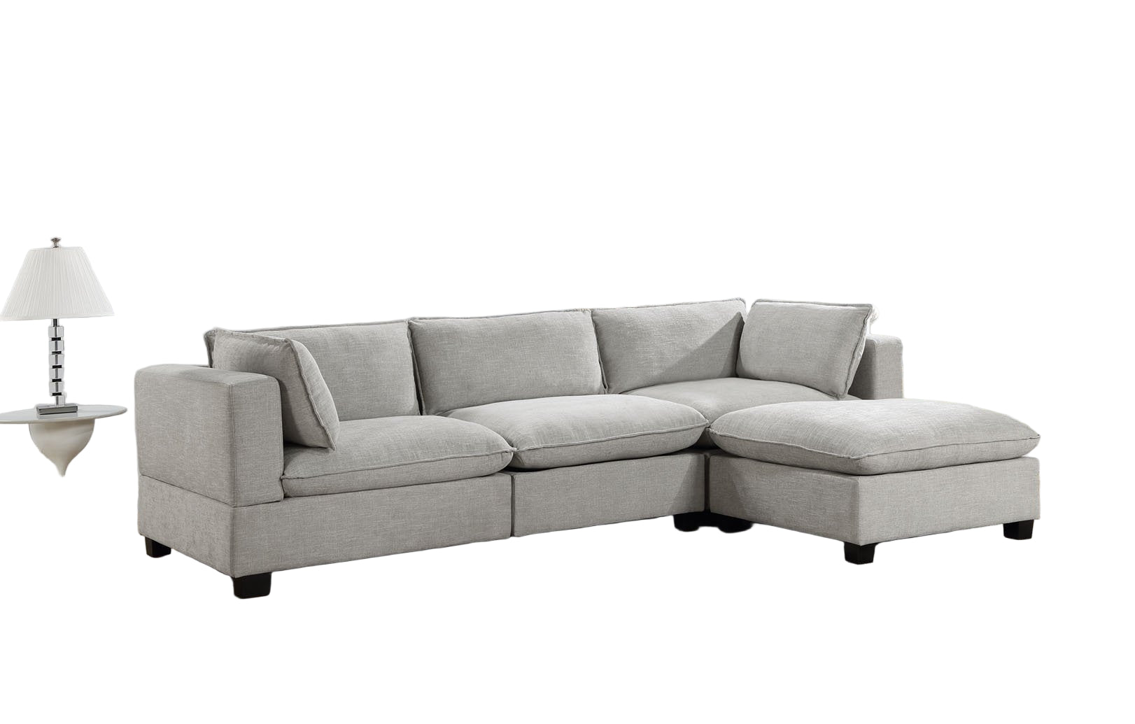 Gray sectional sofa in a living room with a rug and decor items.