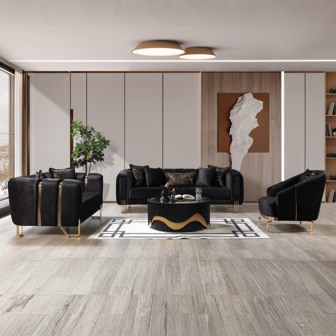 Modern living room with black sofas, a coffee table, and decorative elements.