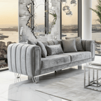 Gray sofa in a modern living room with large mirrors and cityscape view.