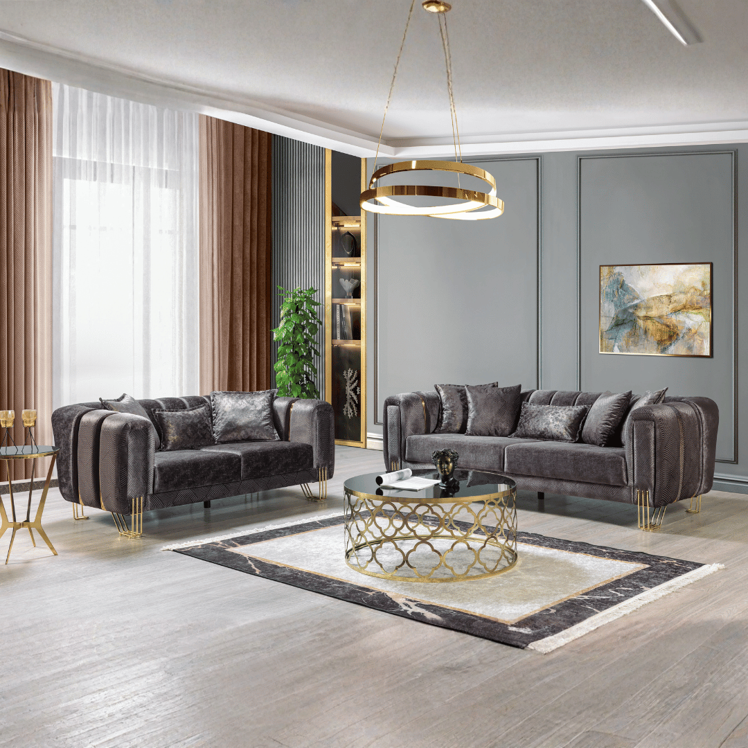 Modern living room with gray sofas, a gold coffee table, and decorative elements.