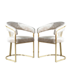 Set of 2 gold velvet dining chairs with white background