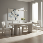 Modern dining room with a white table and chairs, abstract painting, and pendant light.