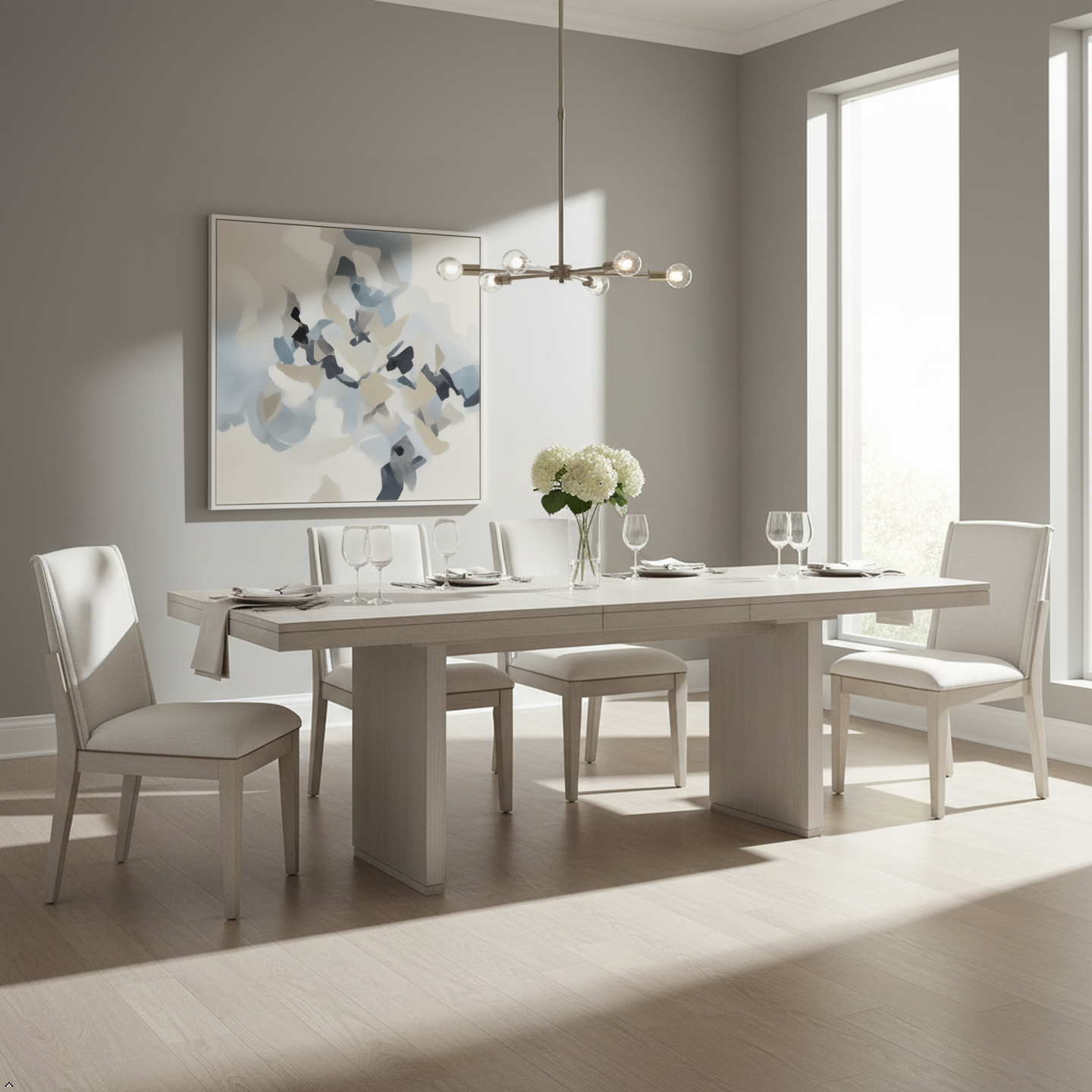 Modern dining room with a white table and chairs, abstract painting, and pendant light.