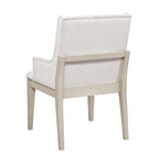 White upholstered chair with light wood frame on a white background