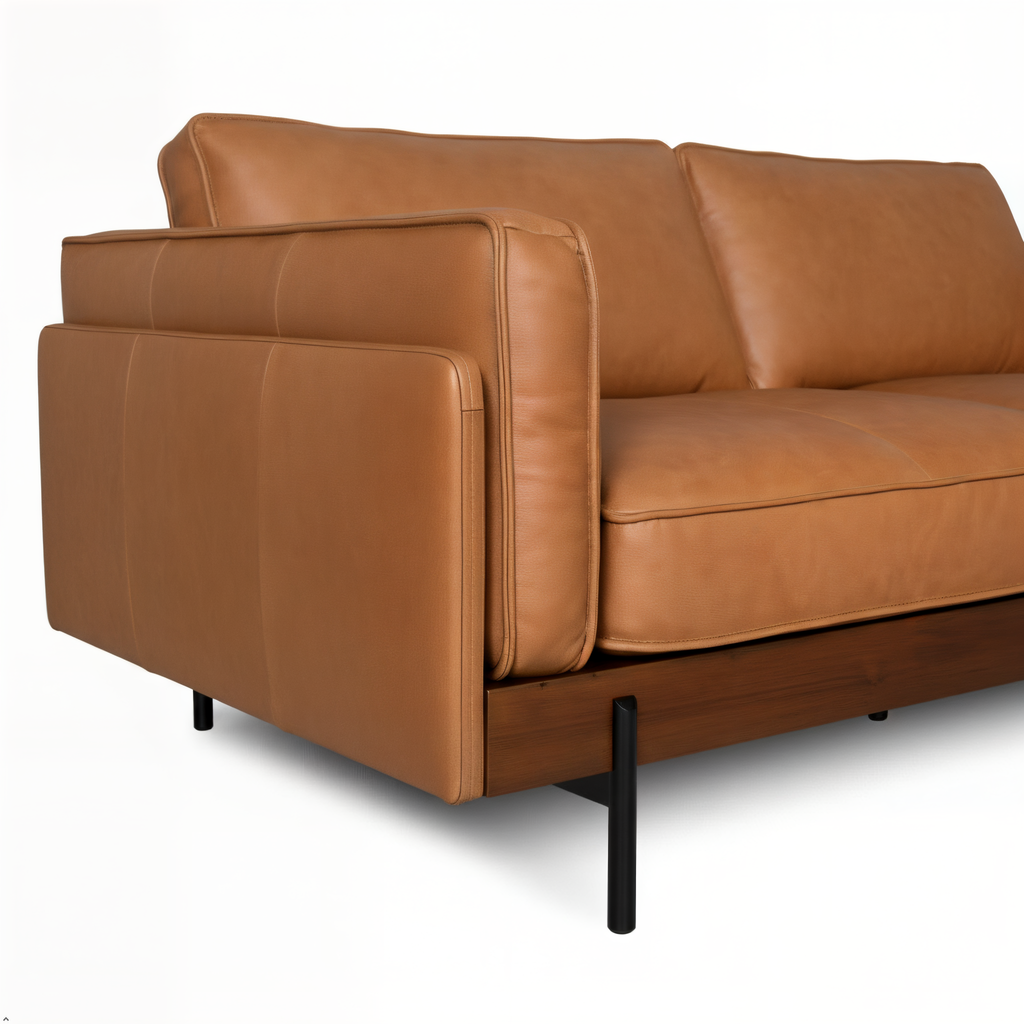 Brown leather sofa with black metal legs on a white background