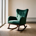 A green velvet rocking chair with a high button-tufted backrest and dark wood rocking base, placed in a sunlit room with light wood floors and a beige wall.
