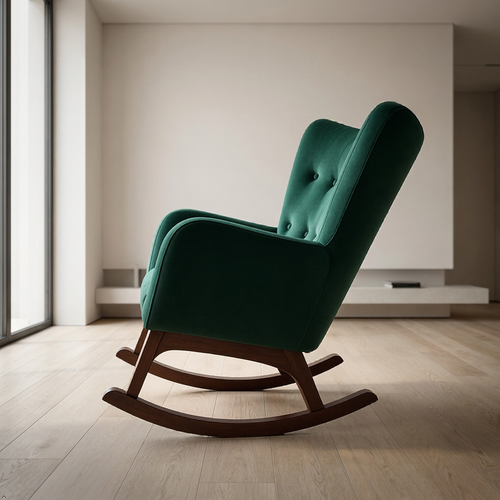 A mid-century modern rocking chair upholstered in deep emerald green velvet with a dark wood rocking base, set in a minimalist room with light wood floors and a neutral wall.