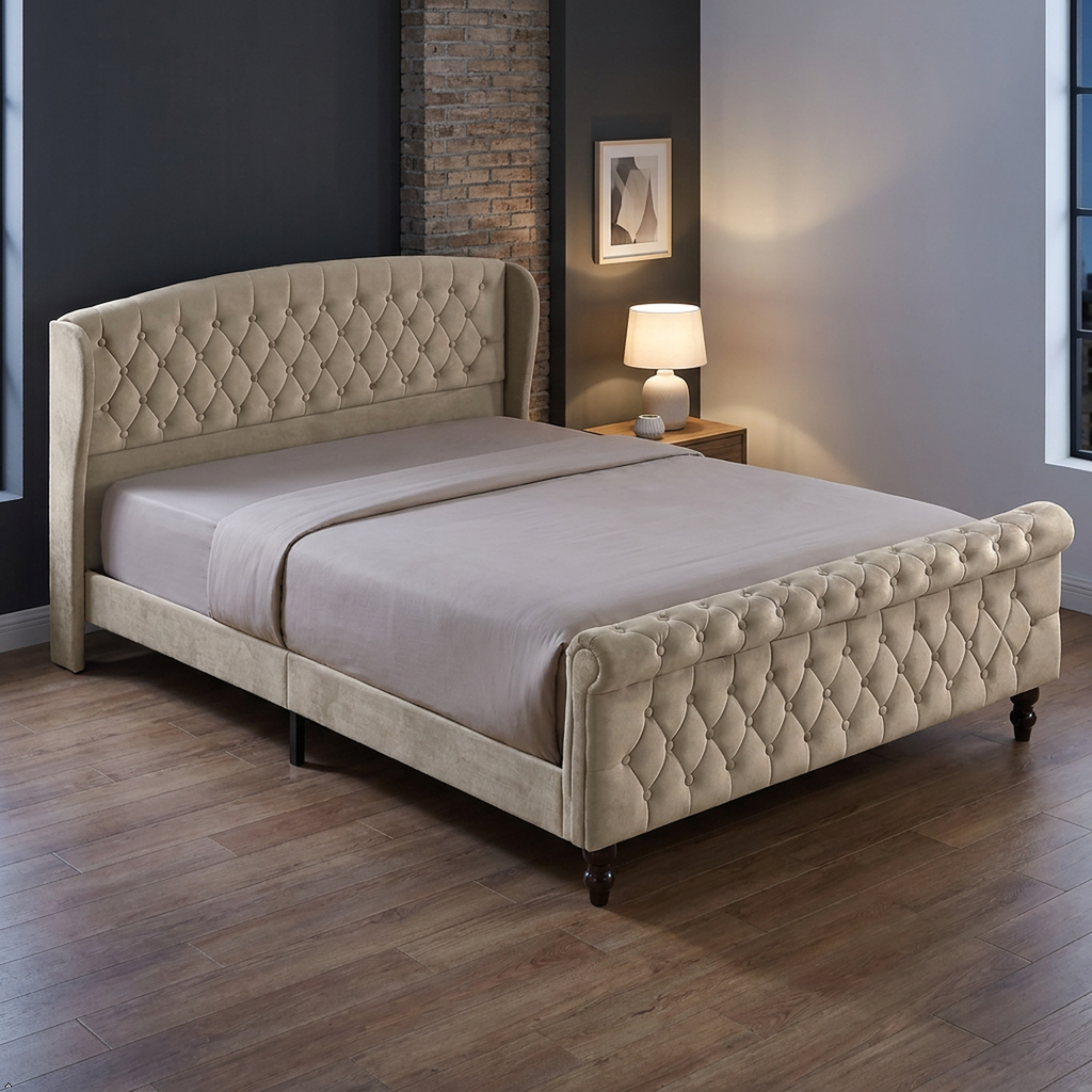 A beige tufted velvet bed frame with a wingback headboard and matching footboard, styled in a modern bedroom setting with a wooden floor, bedside table, and lamp.