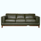 Green leather sofa on a white background