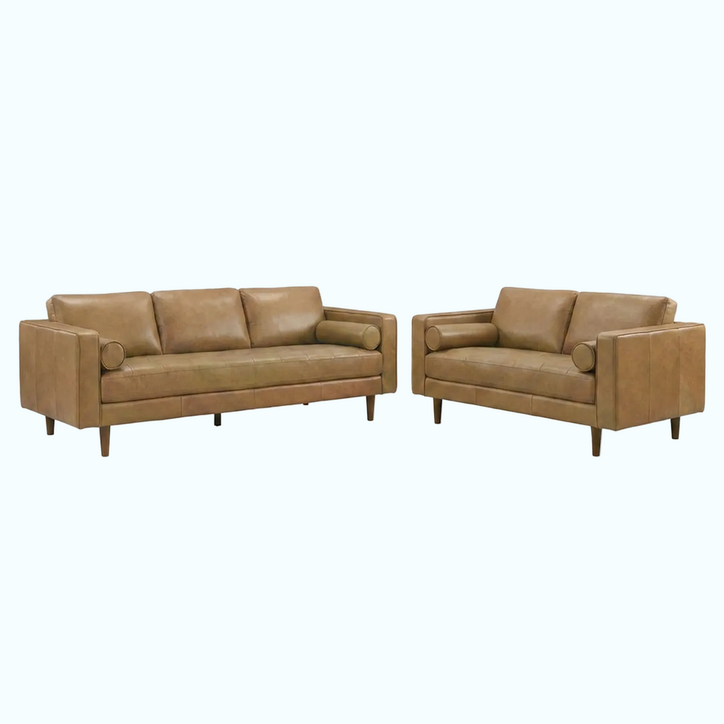 A mid-century modern leather sofa and matching loveseat in a warm tan color, shown on a plain white background.