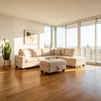 Beige sectional sofa in a living room with large windows and a plant.