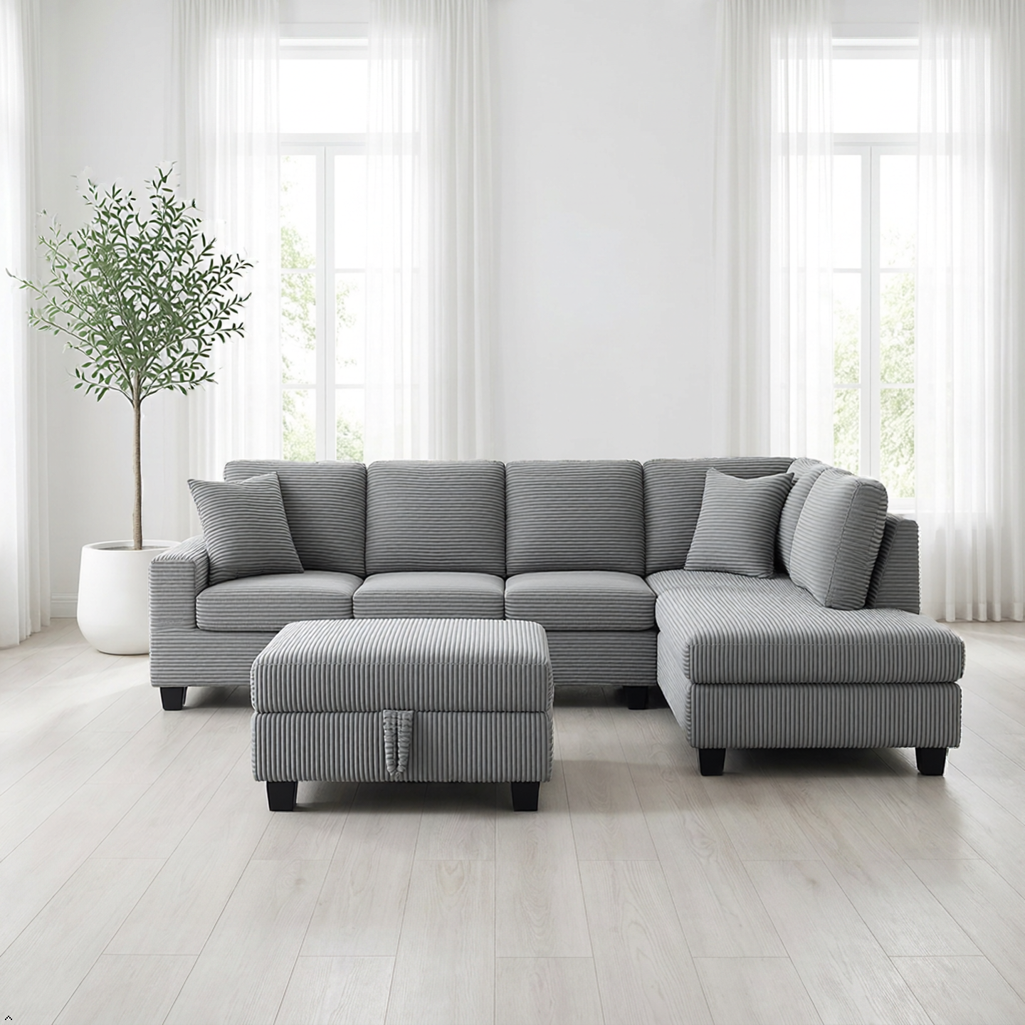 Gray sectional sofa with ottoman in a bright living room