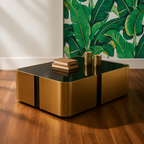 Gold coffee table with books against a leaf-patterned wall