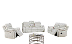 White leather recliner sofa set in a modern living room with plants and a coffee table.