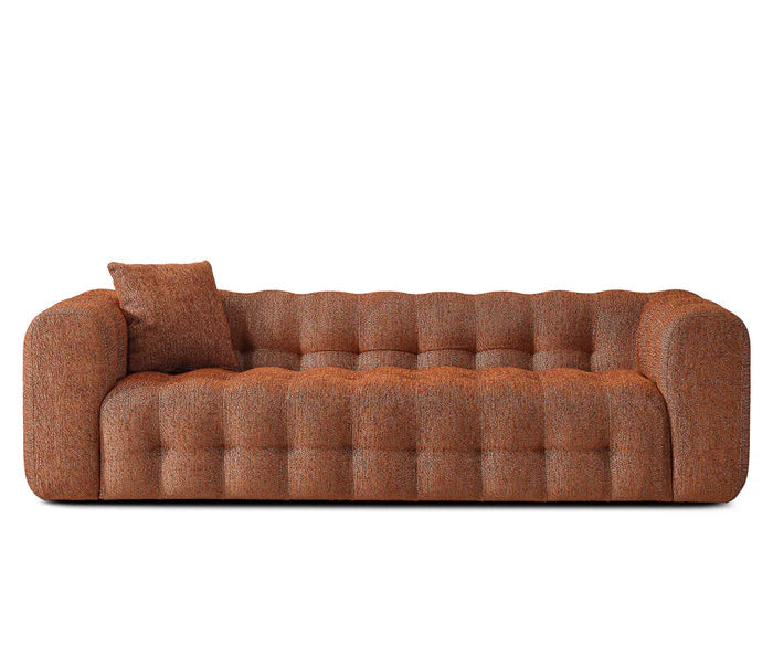 Brown sofa with tufted design on a white background